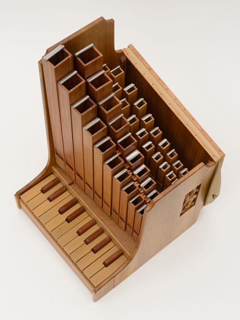 Photograph of a portative organ from above.
